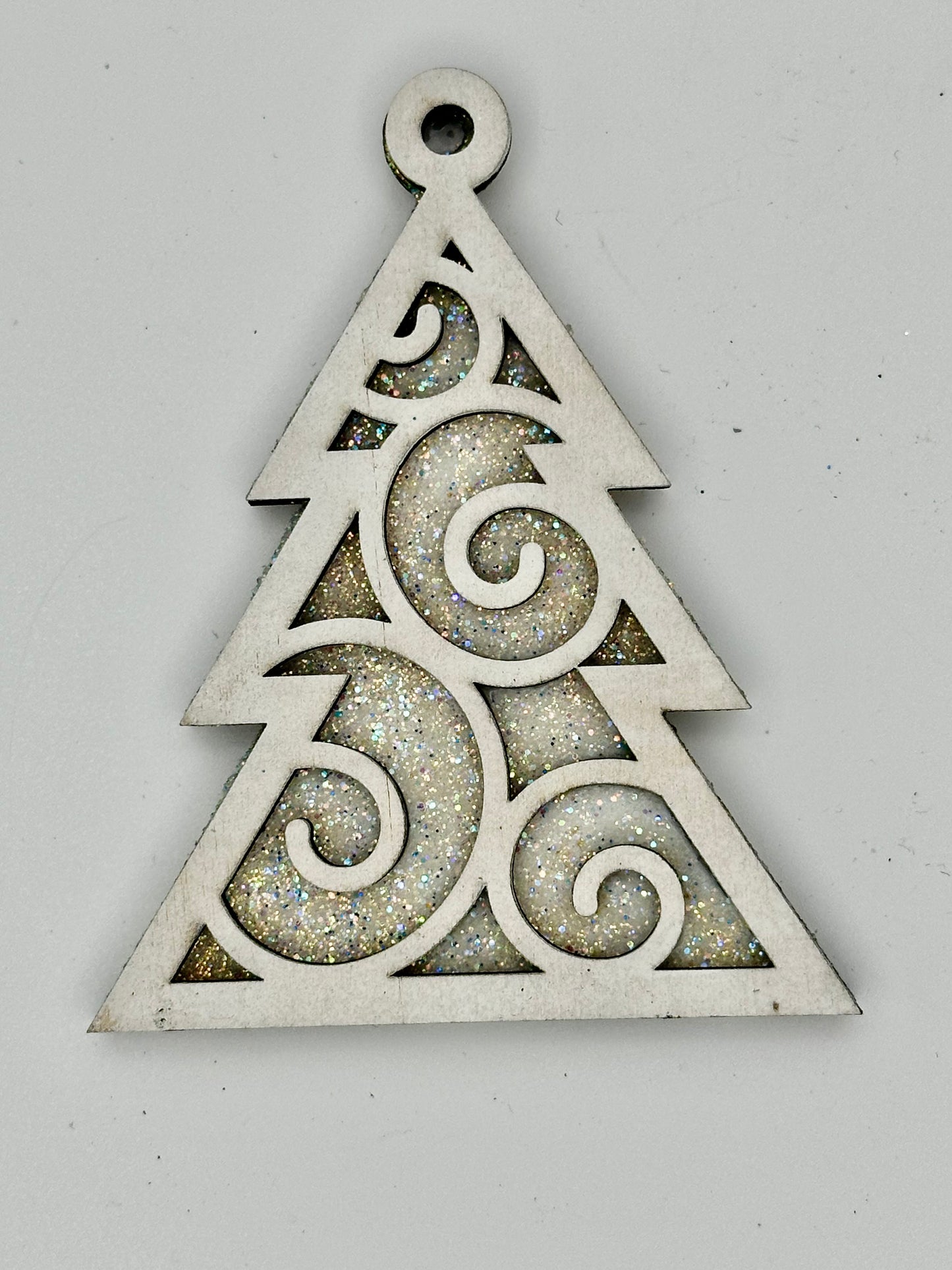 Wooden tree ornament with swirl detail